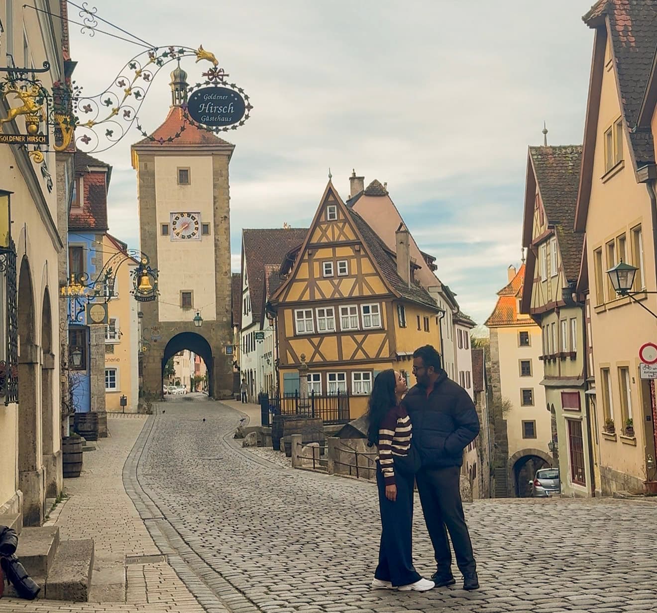 Namrata and Mayur on a cobblestone street in a historic German town