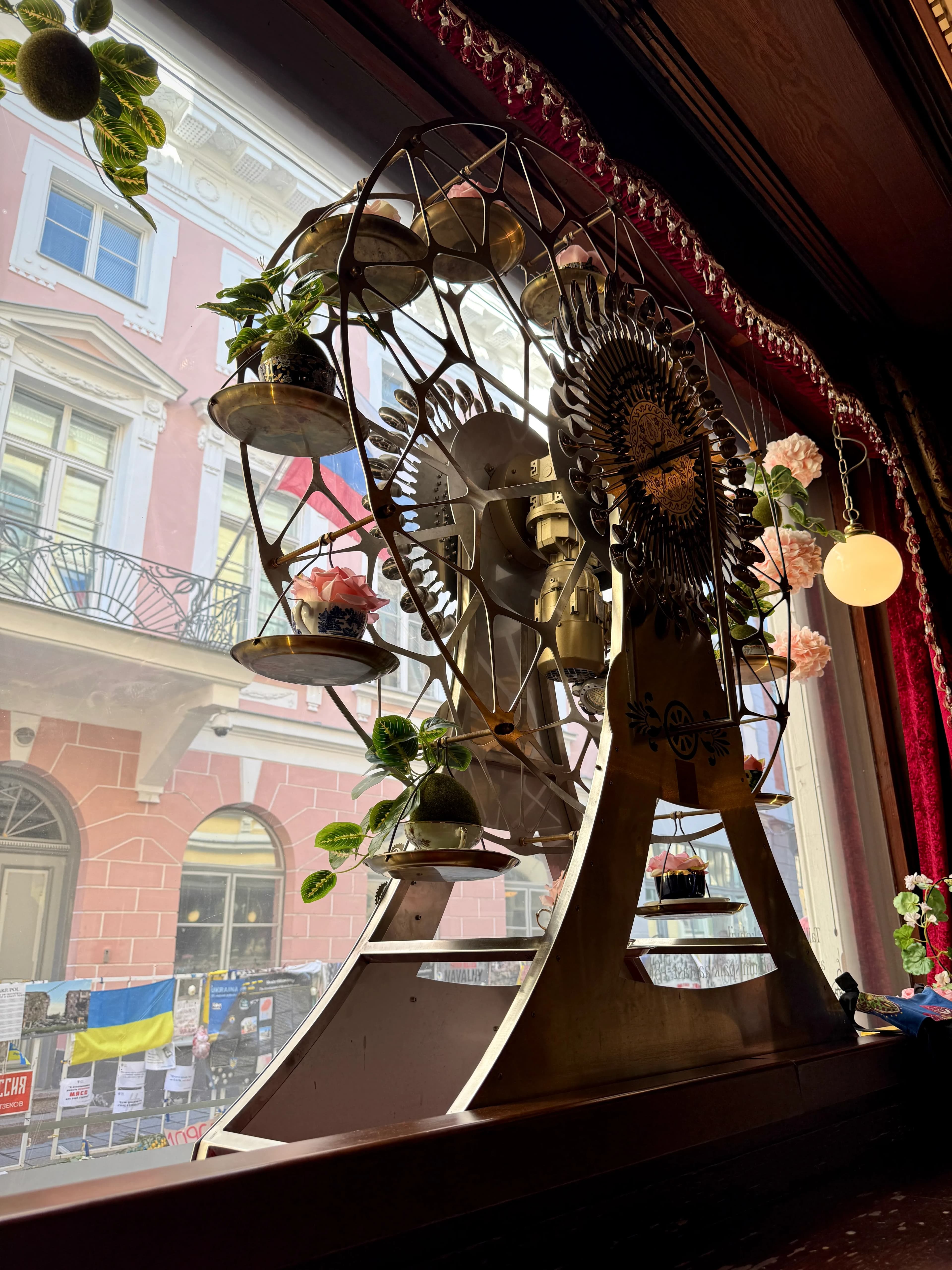 Café Maiasmokk interior with chandeliers and marzipan displays, Tallinn's oldest café since 1864