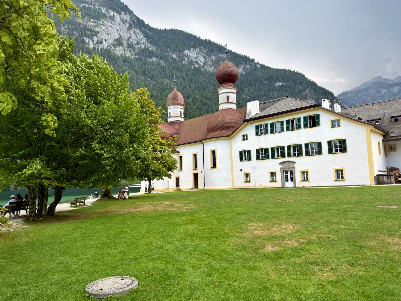 St. Bartholomä church with red onion domes beneath the mountains at Königssee