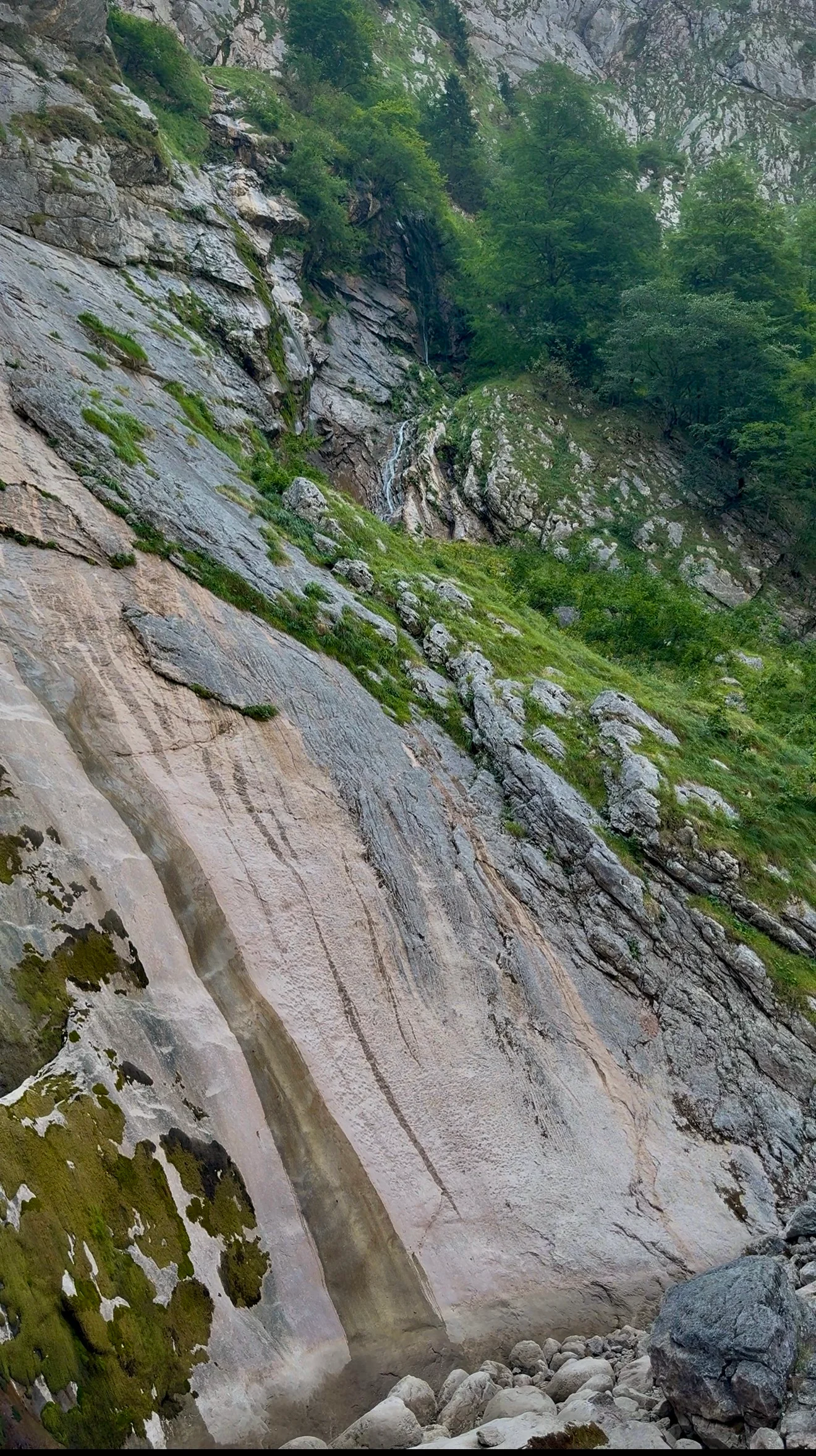 Thin ribbon of water on the Röthbachfall rock face seen from higher up the slope